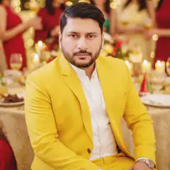 Man in yellow suit at party