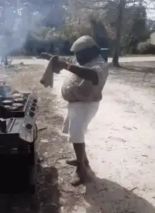 Man grilling with a towel