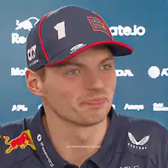 Max Verstappen smirks and shakes head
