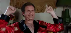 Will Ferrell in red robe dancing