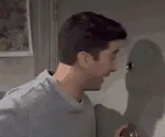 Man hugs a wall