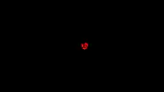 small red heart on black background