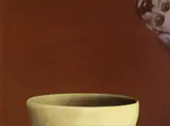Hands cracking a skull egg into a bowl