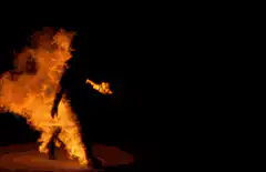 Silhouette of a person engulfed in flames