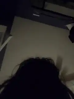 Person looking up at ceiling fan