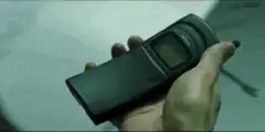 Neo holding a pager