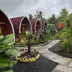 tropical resort cabins with curved roofs
