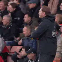 Football manager celebrating on the sideline