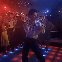 John Travolta dancing on a light-up floor