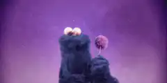 Cookie Monster eats a cookie