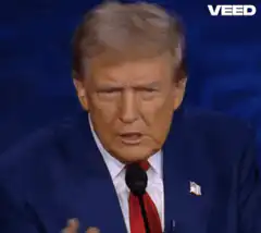 Donald Trump sitting in Moscow