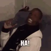 Man laughing with phone GOT HEEEM