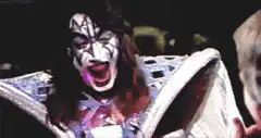 Gene Simmons screaming and falling back