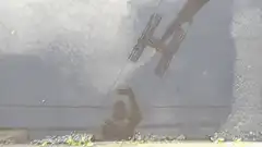 Crane dropping a box on a person