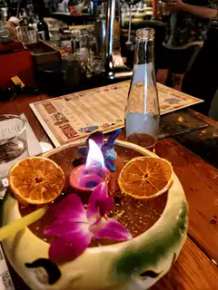 Flaming tiki cocktail on bar