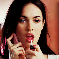 Megan Fox licking a lighter