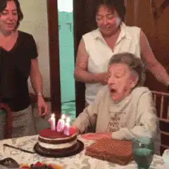 Elderly woman blows out 100 candles
