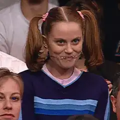 Girl with pigtails laughing hysterically