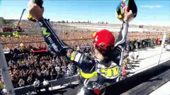 MotoGP rider celebrates with arms raised