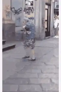 Old lady dancing on the street