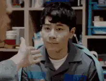 Man gets cheek pinched and smiles