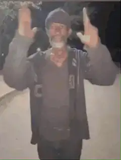 Man dancing on street at night