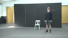 Boy jumps on chair and falls