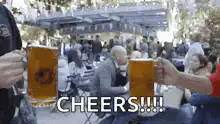 Two people clinking beer mugs cheers