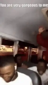 Man raising hand in car