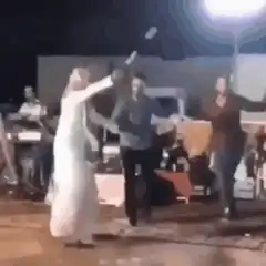 Woman in white dress dancing and spinning