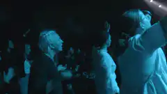 Concert crowd singing Endless Love