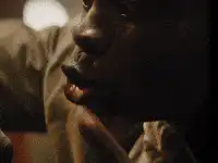 Close-up of a man touching his face