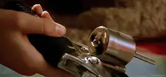 Hand cocking a revolver