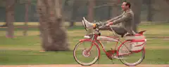 Man riding a bicycle with a megaphone