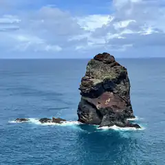 large rock formation in ocean