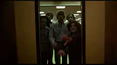 Zombies reaching through glass door