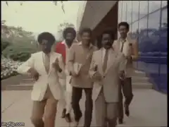 Men in suits dancing outside