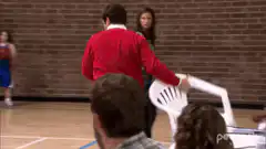 Man throws chair at basketball hoop