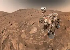 Mars rover selfie on rocky terrain