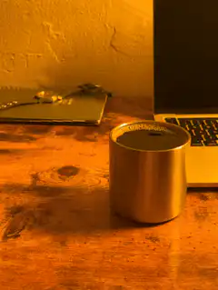 steaming mug on wooden desk