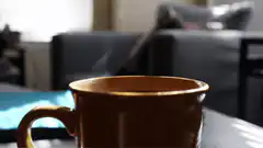 Steaming brown coffee mug
