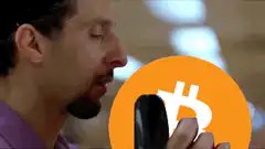 Man holding Bitcoin then revealing Nostr