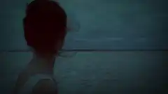 Woman looking out at the ocean