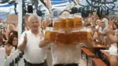 Beer server walks through crowd with giant tray