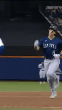 Seattle Mariners player high-fives teammate