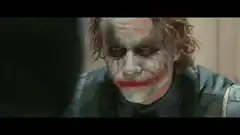 Batman punches the Joker