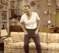Seinfeld sitting on couch
