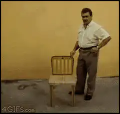 Man folds chair into briefcase