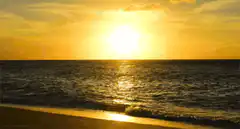 sunset over ocean waves