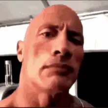 The Rock squinting